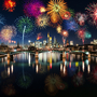 Feuerwerk über einer nächtlich beleuchteten Stadt mit Fluss und Brücke.